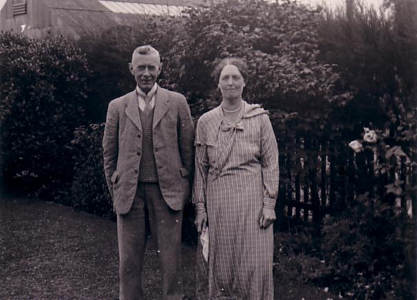 Francis Bergh standing in garden with M.R.B.