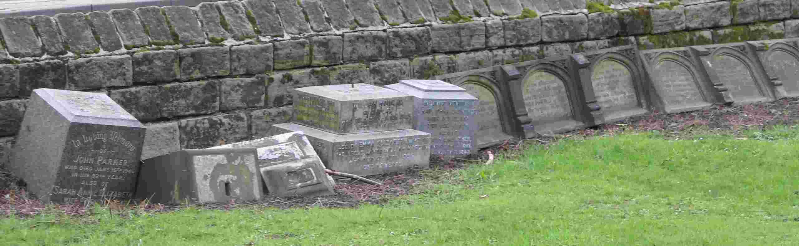 Many tombstones have been laid against the walls of the grounds of St Paul's Church, 
                                            Shipley, Diocese of Bradford